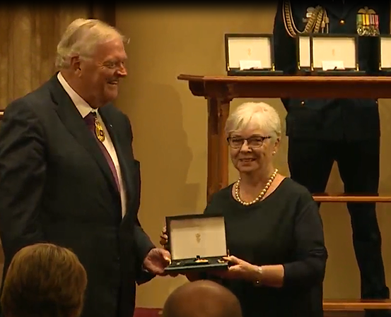 The Honourable Kim Beazley presents Ann Jones with her Order of Australia medal